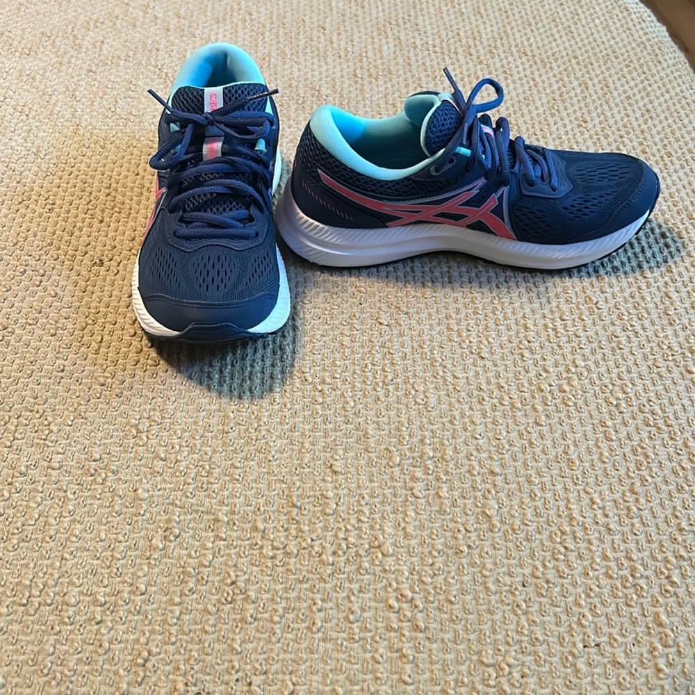 ASICS sneakers.